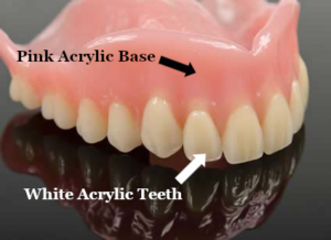 Parts of a full denture, including the pink acrylic base and the white acrylic teeth